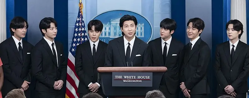 BTS_during_a_White_House_press_conference_May_31,_2022_(cropped)
